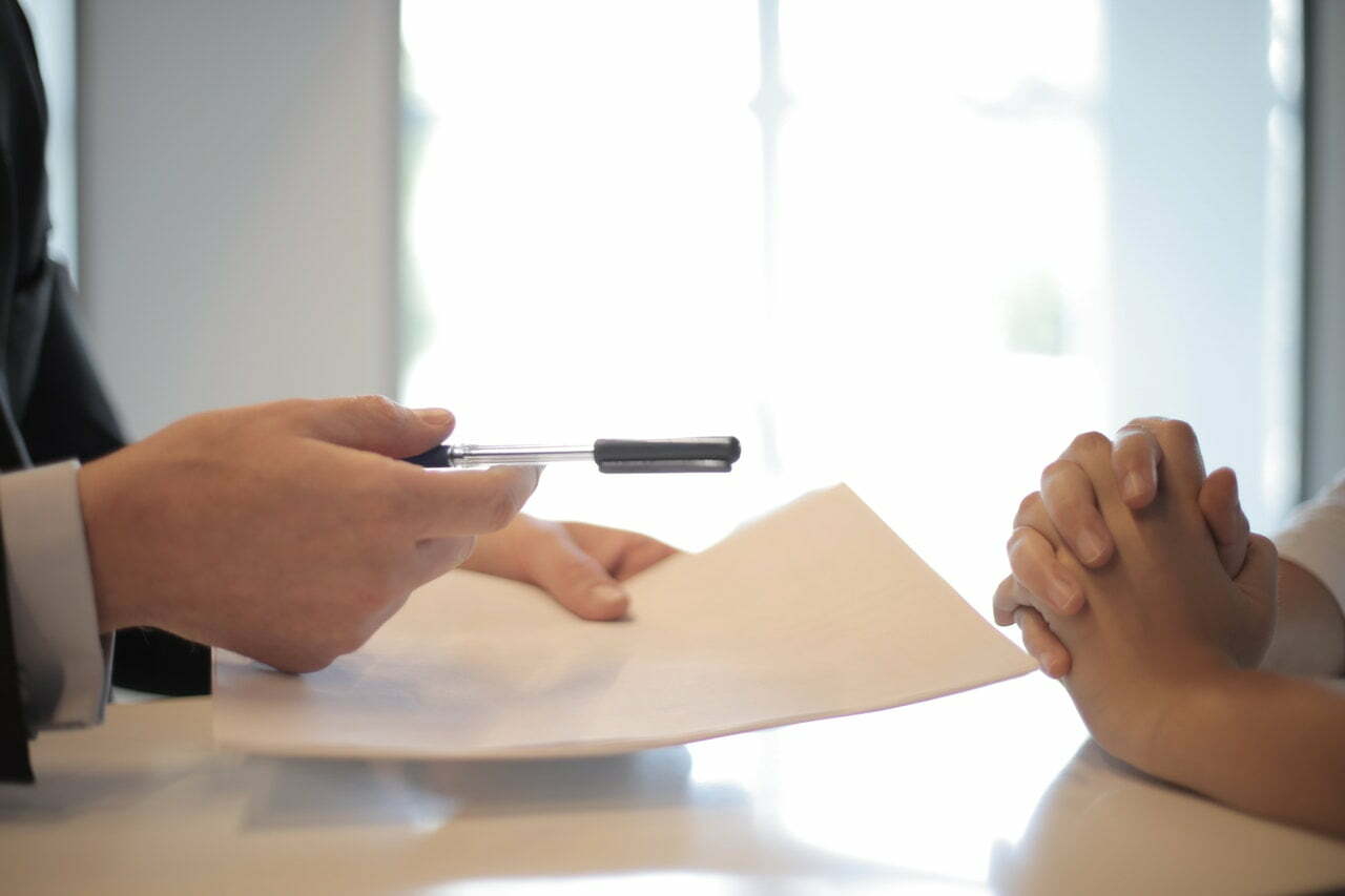 a person writing on a paper