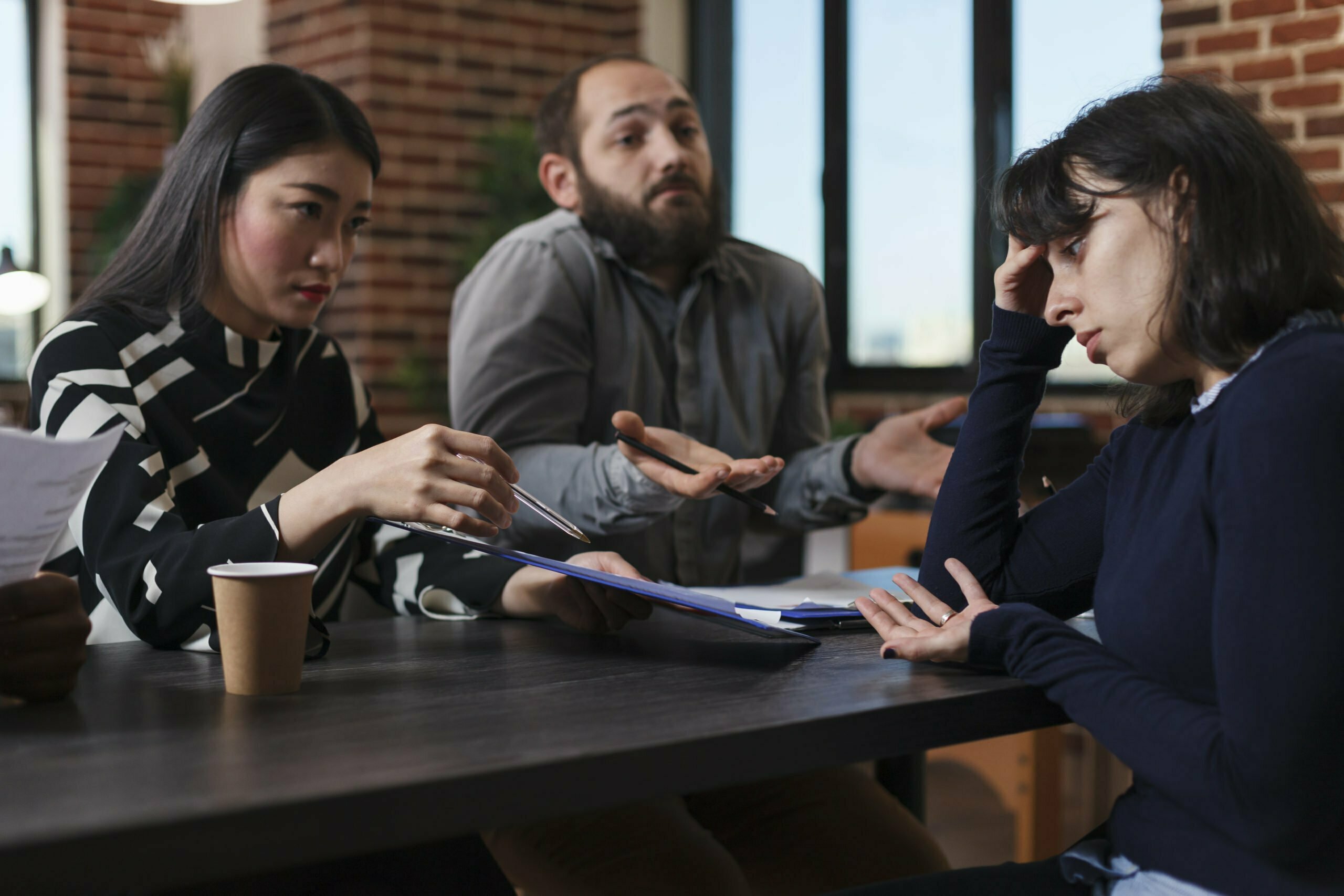 Tired recruiter listening to irritated job applicants complaining about absurd salary offer